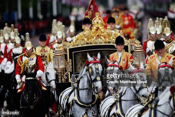 Queen Elizabeth II returns to Buckingham Palace in the new Diamond Jubilee state coach following the State Opening of Parliament on June 4, 2014 in...