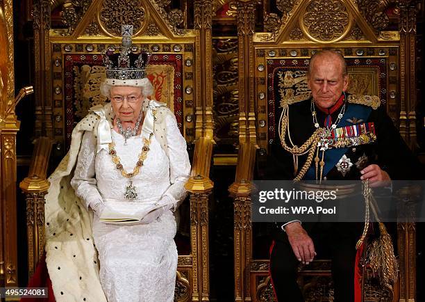 Queen Elizabeth II sits with Prince Philip, Duke of Edinburgh as she delivers her speech during the State Opening of Parliament in the House of Lords...