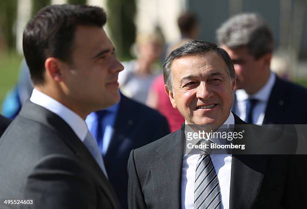 Aras Agalarov, founder of Crocus Group, right, and his son Emin Agalarov, commercial director of Crocus Group, wait ahead of the opening ceremony for...
