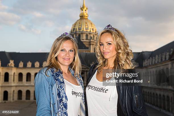 Adriana Karembeu and her sister Natalia Sklenarikova pose at Les Invalides during the Rallye des Princesses cocktail as they take part in the 15th...