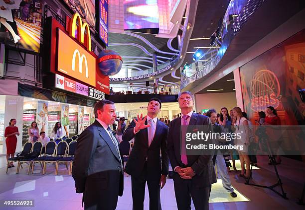 Aras Agalarov, founder of Crocus Group, left, Herman Gref, chief executive officer of OAO Sberbank, right, and Emin Agalarov, commercial director of...