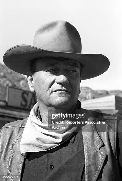 American actor John Wayne dressed as a cowboy on the set of the film "The Sons of Katie Elder". 1965