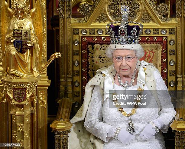 Queen Elizabeth II delivers her speech during the State Opening of Parliament in the House of Lords at the Palace of Westminster on June 4, 2014 in...