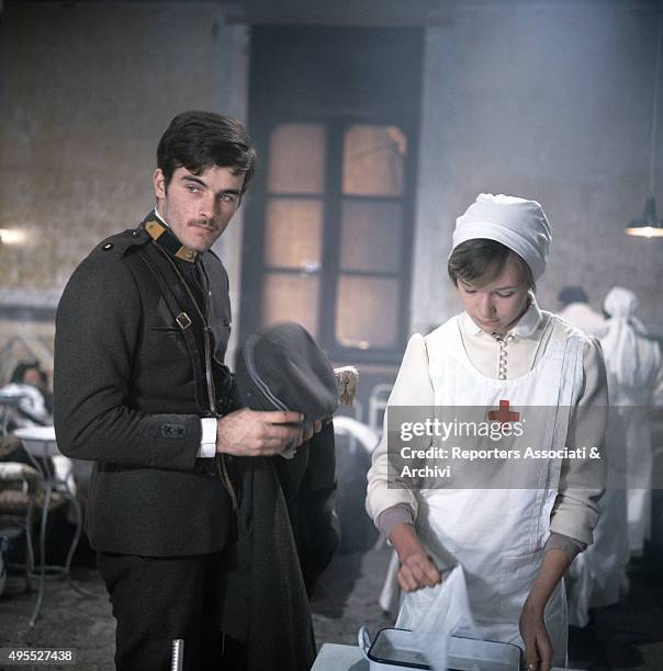 American actor Mark Frechette standing in uniform at the hospital beside a Red Cross nurse in a scene from the film 'Many Wars Ago' directed by...