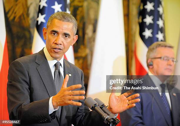 President Barack Obama speaks while Polish President Bronislaw Komorowski listens during a joint press conference after their meeting on June 3, 2014...