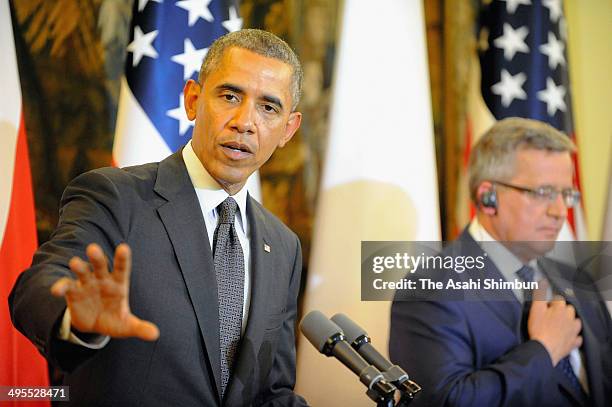 President Barack Obama speaks while Polish President Bronislaw Komorowski listens during a joint press conference after their meeting on June 3, 2014...