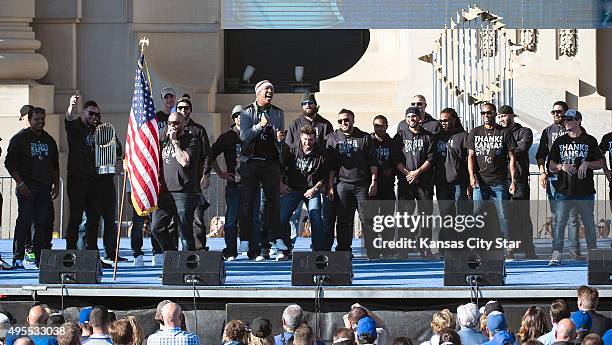 The Kansas City Royals' Jonny Gomes carries the flag and pumps up the crowd during the team's World Series celebration on Tuesday, Nov. 3 at Union...