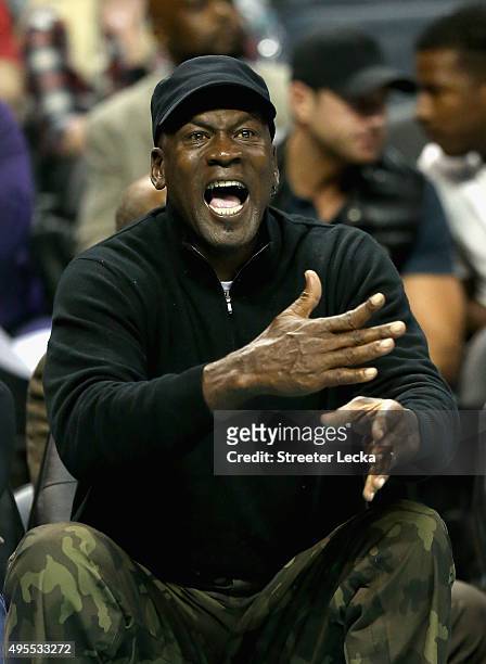 Owner of the Charlotte Hornets, Michael Jordan, reacts to a call during their game against the Chicago Bulls at Time Warner Cable Arena on November...