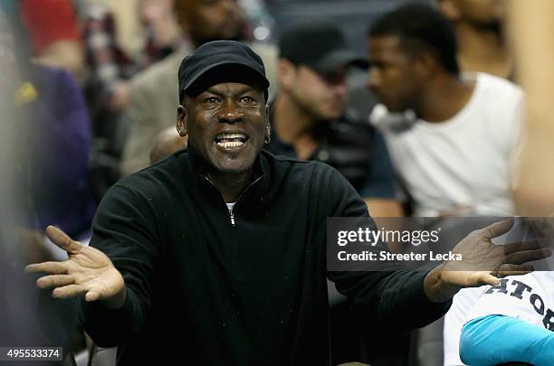 Owner of the Charlotte Hornets, Michael Jordan, reacts to a call during their game against the Chicago Bulls at Time Warner Cable Arena on November...