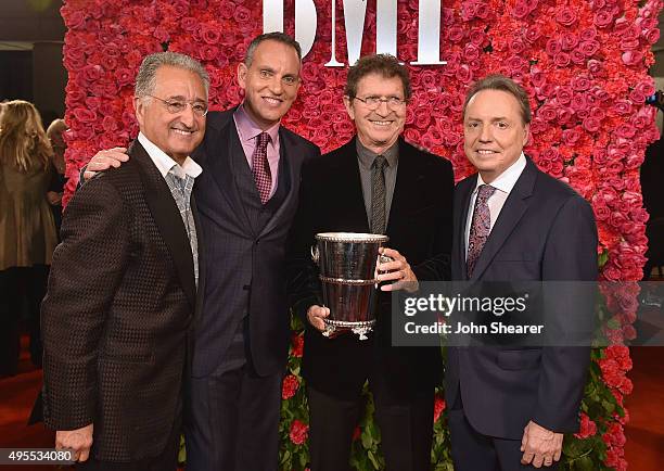 Del Bryant of BMI, President and CEO of BMI, Michael ONeill, honoree Mac Davis, and BMI Vice President, Writer/Publisher Relations, Nashville, Jody...