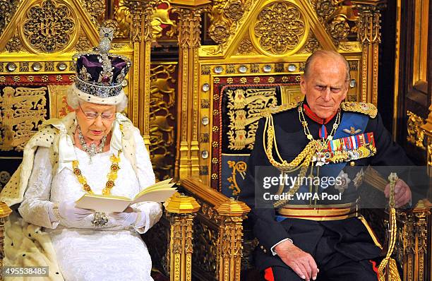 Queen Elizabeth II sits with Prince Philip, Duke of Edinburgh as she delivers her speech during the State Opening of Parliament in the House of Lords...