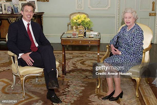 Rare glimpse of Queen Elizabeth II giving an audience at Buckingham Palace to Prime Minister Tony Blair on May 20, 2002 in London, England. The...