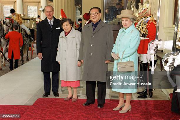 Queen Elizabeth II and Prince Philip, Duke of Edinburgh greet the President of the People's Republic of China Jiang Zemin and his wife Madame Wang...