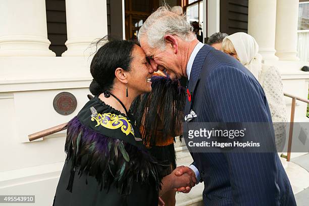 Prince Charles, Prince of Wales, is welcomed with a hongi from New Zealand Defence Force Flight Sergeant Wai Paenga during a welcome ceremony at...