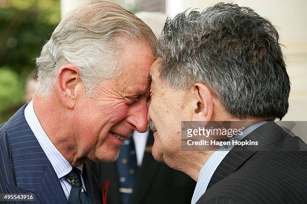 Prince Charles, Prince of Wales, is welcomed with a hongi from Government House Kaumatua, Mr Lewis Moeau, during a welcome ceremony at Government...