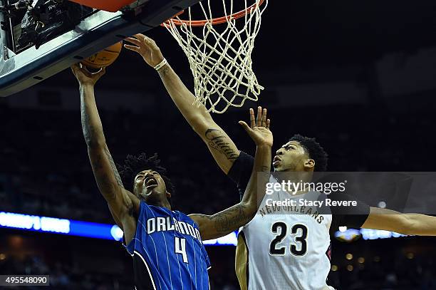 Anthony Davis of the New Orleans Pelicans blocks a shot by Elfrid Payton of the Orlando Magic during the second half of a game at the Smoothie King...