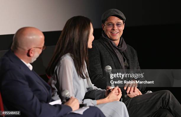 Joe Neumaier, Angelina Jolie and Brad Pitt attend an official Academy Screening of BY THE SEA hosted by The Academy Of Motion Picture Arts And...