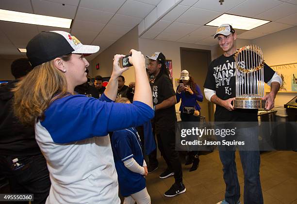 Chris Young of The Kansas City Royals poses with the championship trophy at Sprint Center on November 3, 2015 in Kansas City, Missouri.