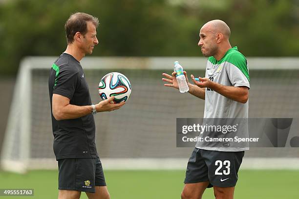 Mark Bresciano of the Socceroos talks to a trainer during an Australian Socceroos training session at Arena Unimed Sicoob on June 4, 2014 in Vitoria,...