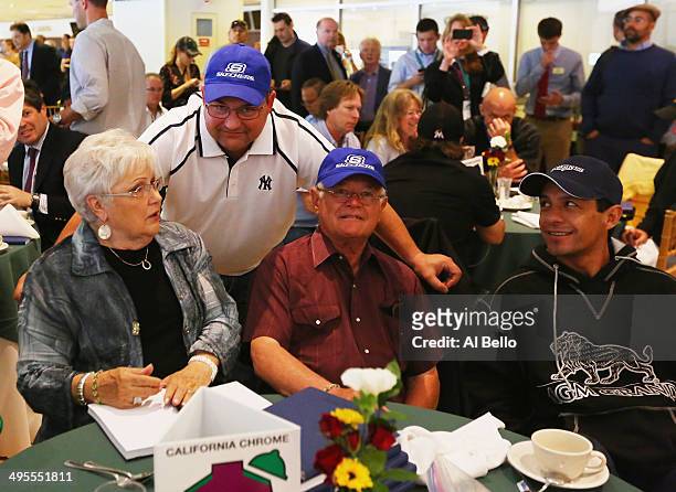 Assistant Trainer of California Chrome Alan Sherman speaks to his Mother Faye and Father Art who is the head trainer as Jockey Victor Espinoza looks...