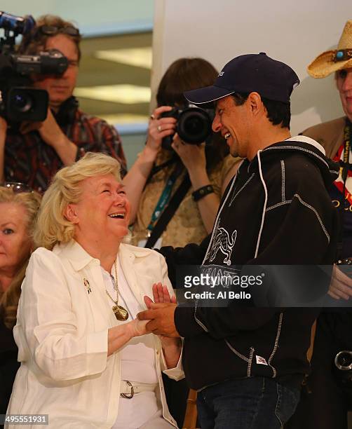 Jockey for California Chrome Victor Espinoza speaks to Patrice Wolfson, owner of the last Triple Crown winner Affirmed during the Belmont stakes Draw...
