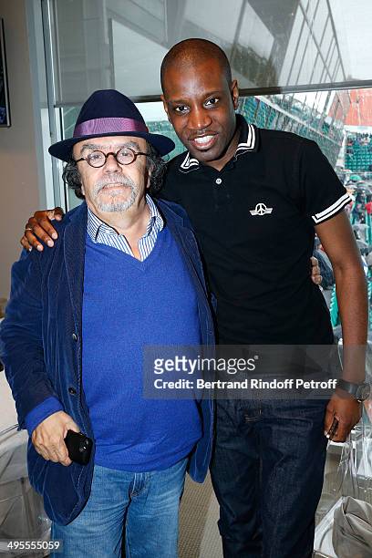 Actor Jean-Michel Ribes and rapper Abd al Malik pose at France Television french chanels studio whyle the Roland Garros French Tennis Open 2014 - Day...
