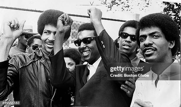 Black Power Leader, Stokely Carmichael with Aides. Exact date unknown likely photographed between 1960 and 1966.