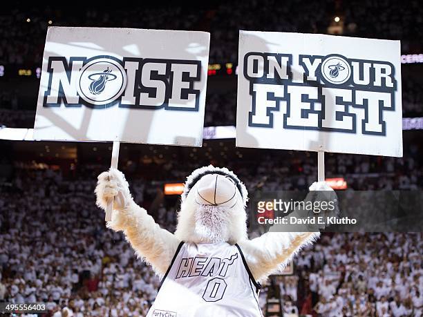 Playoffs: Miami Heat mascot Burnie holding up signs that read NOISE and ON YOUR FEET in stands during game vs Indiana Pacers at American Airlines...