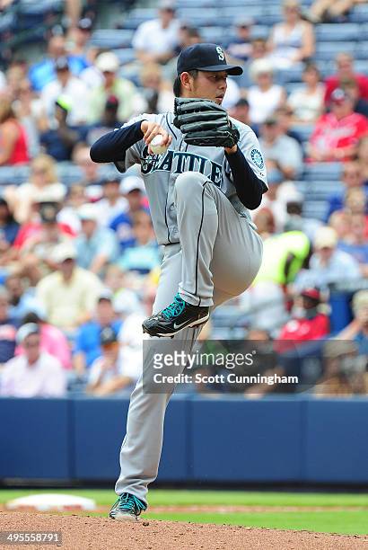 Hisashi Iwakuma of the Seattle Mariners throws a 2nd inning pitch against the Atlanta Braves at Turner Field on June 4, 2014 in Atlanta, Georgia.