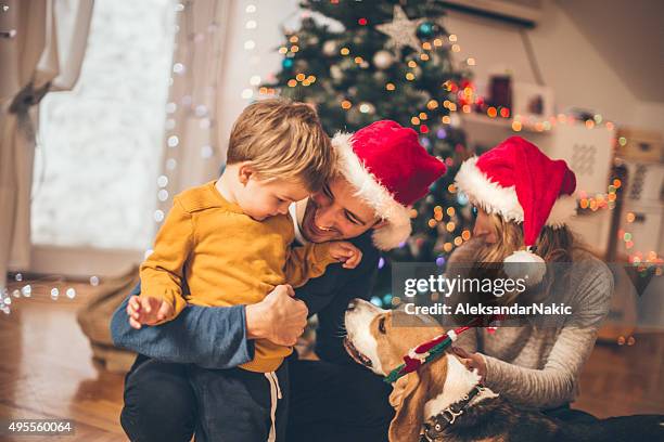 winter time and family love - christmas morning stock pictures, royalty-free photos & images