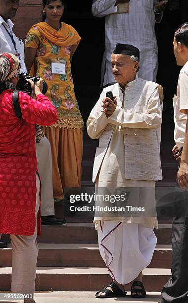 Bhagat Singh Koshyari arrives to attend the first day of the newly elected 16th Lok Sabha at the Parliament House on June 4, 2014 in New Delhi,...