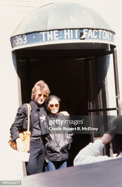 Musician John Lennon and wife Yoko Ono pose for a photo outside the Hit factory recording studio on September 18, 1980 in New York City, New York.