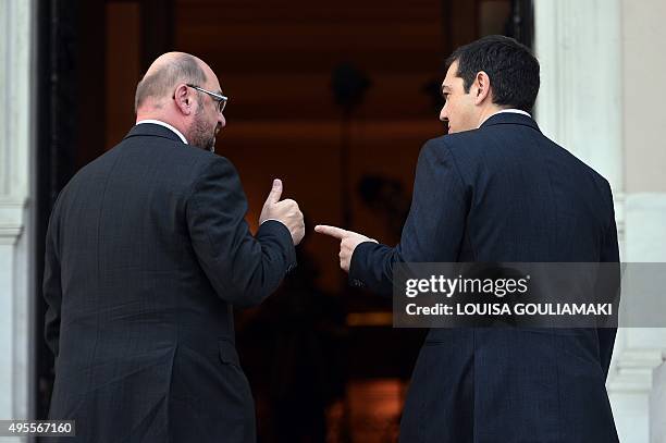 Greek prime minister Alexis Tsipras talks with European Parliament President Martin Schulz upon his arrival for their meeting in Athens on November...