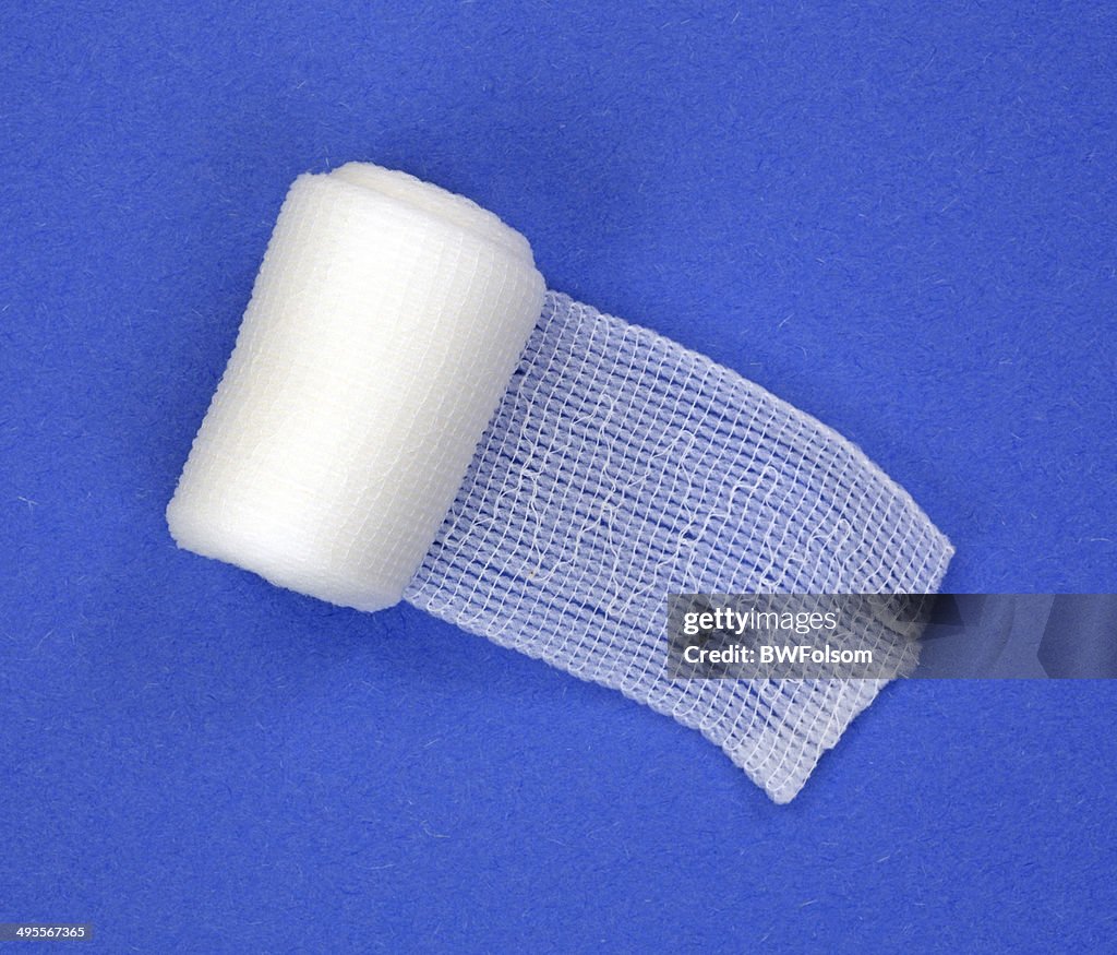 Roll of first aid gauze unrolling