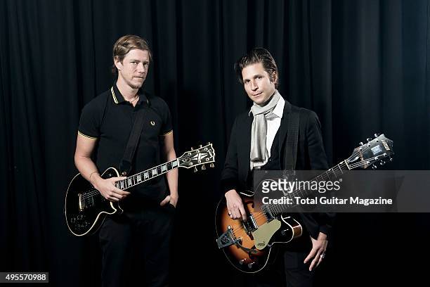Portrait of Paul Banks and Daniel Kessler, guitarists with American indie rock group Interpol, photographed before a live performance at The...