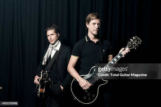 Portrait of Paul Banks and Daniel Kessler, guitarists with American indie rock group Interpol, photographed before a live performance at The...