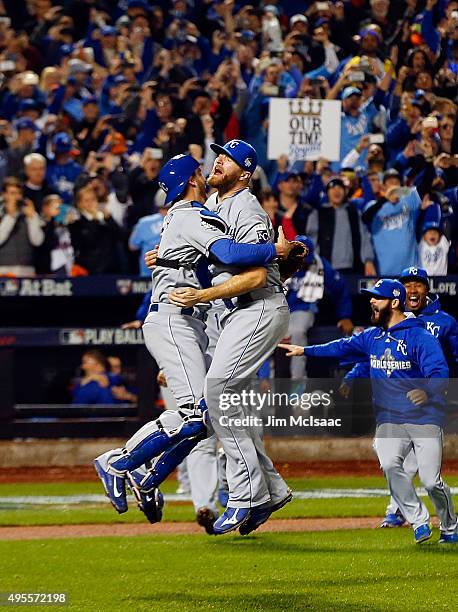 Wade Davis and Drew Butera of the Kansas City Royals celebrate after defeating the New York Mets in game five of the 2015 World Series at Citi Field...