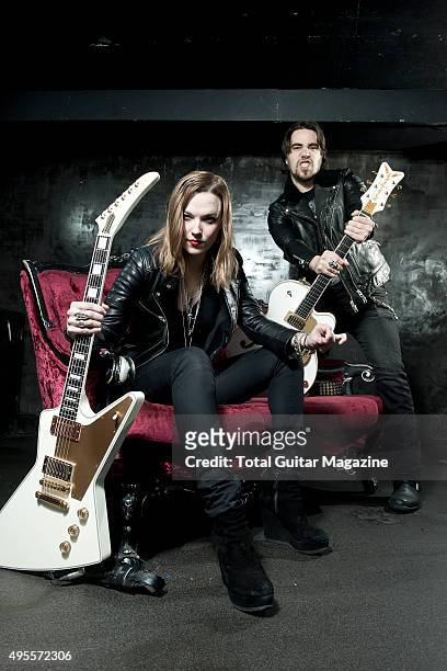 Portrait of American musicians Lzzy Hale and Joe Hottinger, guitarists with hard rock group Halestorm, photographed before a live performance at Rock...