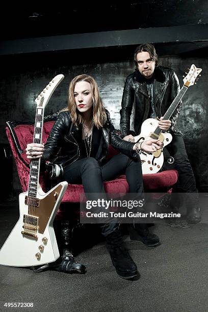 Portrait of American musicians Lzzy Hale and Joe Hottinger, guitarists with hard rock group Halestorm, photographed before a live performance at Rock...