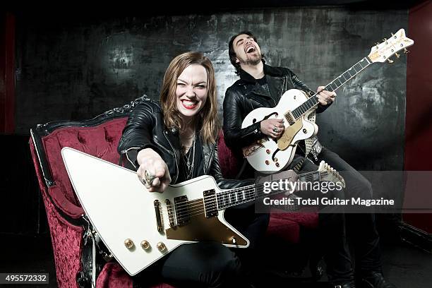 Portrait of American musicians Lzzy Hale and Joe Hottinger, guitarists with hard rock group Halestorm, photographed before a live performance at Rock...