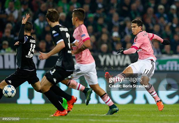 Hernanes of Juventus kicks the ball during the UEFA Champions League Group D match between VfL Borussia Monchengladbach and Juventus Turin at...