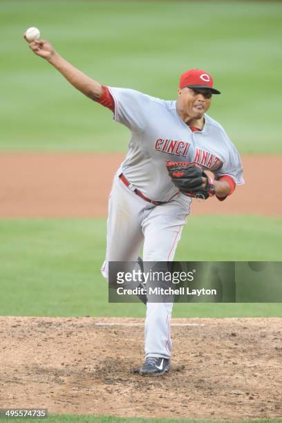 Alfredo Simon of the Cincinnati Reds takes a swing during a baseball game against the Washington Nationals on May 21, 2014 at Nationals Park in...