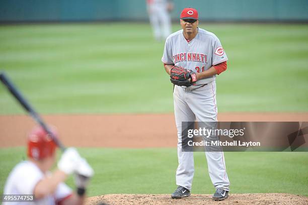 Alfredo Simon of the Cincinnati Reds takes a swing during a baseball game against the Washington Nationals on May 21, 2014 at Nationals Park in...