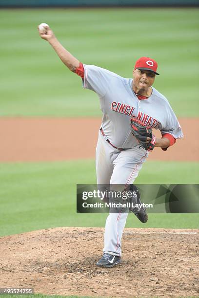 Alfredo Simon of the Cincinnati Reds takes a swing during a baseball game against the Washington Nationals on May 21, 2014 at Nationals Park in...