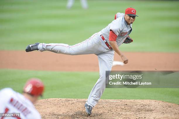 Alfredo Simon of the Cincinnati Reds takes a swing during a baseball game against the Washington Nationals on May 21, 2014 at Nationals Park in...