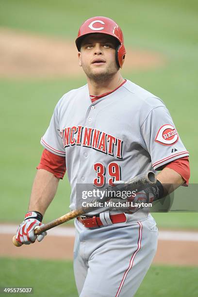 Devin Mesoraco of the Cincinnati Reds walks back to the dug out during a baseball game against the Washington Nationals on May 21, 2014 at Nationals...