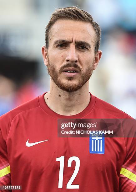 Greek goalkeeper Panagiotis Glykos poses before a World Cup preparation friendly match against Nigeria in Chester, Pennsylvania, on June 3, 2014. AFP...