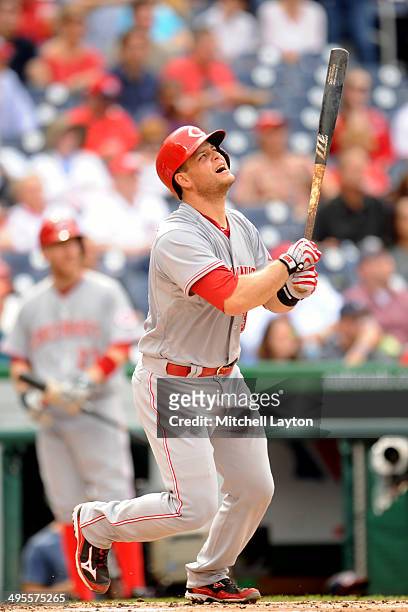 Devin Mesoraco of the Cincinnati Reds takes aswing during a baseball game against the Washington Nationals on May 21, 2014 at Nationals Park in...
