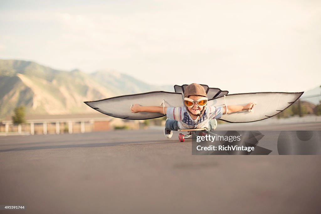 Young Boy with Wings Flies On Skateboard