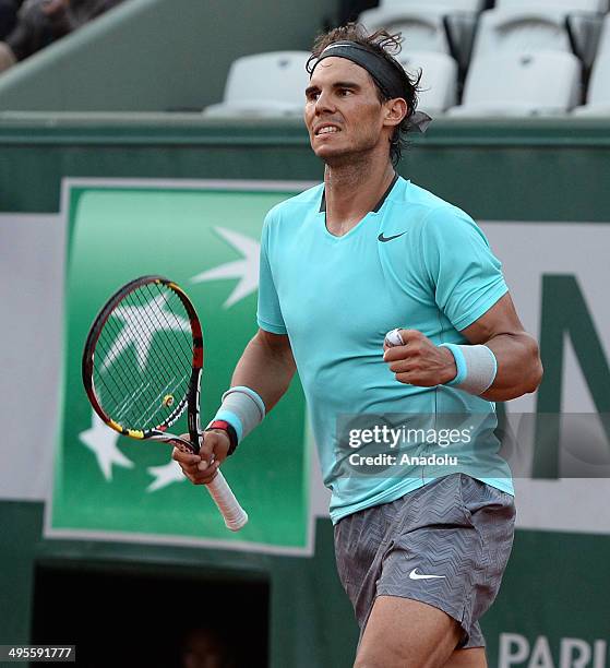 Rafael Nadal of Spain celebrates his victory over his compatriot David Ferrer during their quarter final match of the French Open tennis tournament...